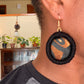 Brown Gold and Black Print Fabric Earrings Made with Brown Gold and Black Print Fabric with rope wrapped in black yarn on the border.