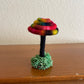 tie dye mirror Made with bright multicolored yarn wrapped around rope and shaped into a mushroom with small flat platform for standing, perfect for mushroom lovers and or collectors, can also be used as an ornament (hook is included in order)  Materials: acrylic yarn, rope, hot glue  Dimensions: